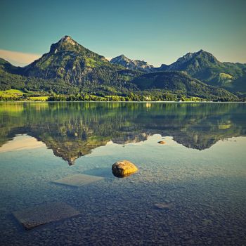 Beautiful landscape with lake and mountains in summer. Natural colorful background. Wolfgangsee lake in the Austrian applause.