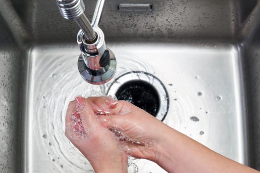Woman washing hands with antibacterial soap for corona virus prevention, hygiene to stop spreading coronavirus covid19
