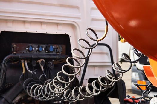 Contact cables. Spiral cable connecting the trailer. Close-up.