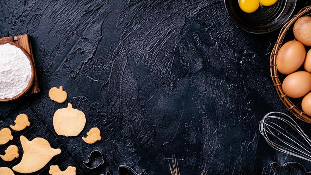 Design concept of making Halloween cookies, baking recipe ingredients layout of preparing party, top view, flat lay, overhead, blank copy space.
