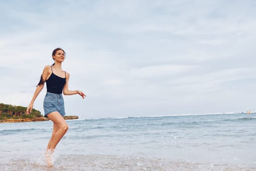 relax woman sea smile beach running sunset positive fun tan hair ocean summer hair long travel lifestyle flight vacation carefree young freedom