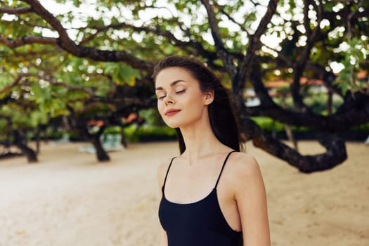 copy woman vacation nature smile peaceful beach young caucasian smiling hair sky long space walking sunset sea sunlight happy summer shore sand ocean