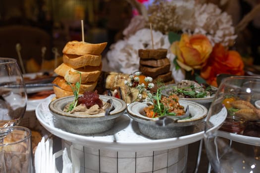 assorted snacks with bruschetta and pate on the festive table.