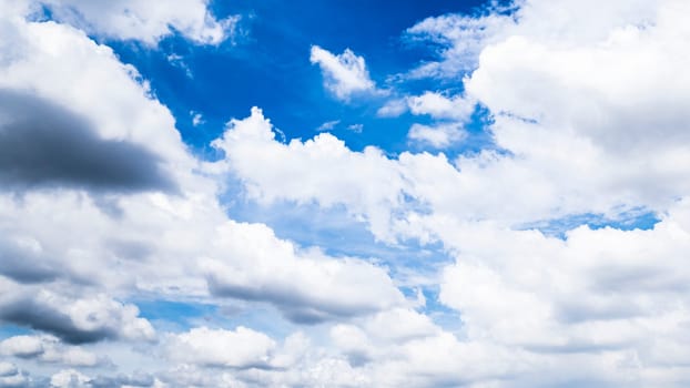 Beautiful white fluffys clouds sky background with blue sky background for copy space.