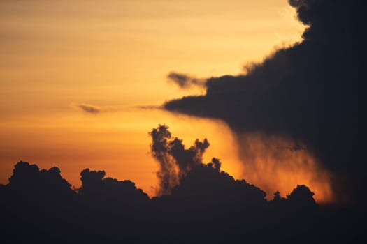 Evening sky sunset.  big puffy cumulus and long stratus clouds. sky background with clouds