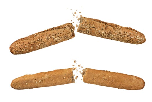 Whole grain rye French baguette, isolate. A set of rye baguettes broken into 2 parts, the crumbs fly in different directions on a white isolated background. Side view, from below