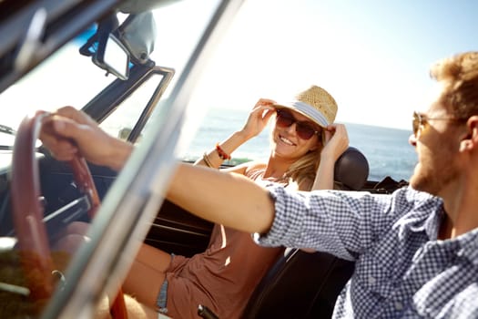 Car road trip, travel and driving couple on bonding holiday adventure, transportation journey or fun summer vacation. Love flare, convertible automobile and driver on Canada nature countryside tour.