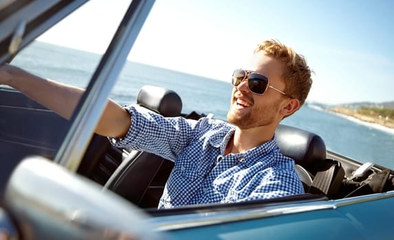 Car road trip, travel and laughing man on holiday adventure, transportation journey or fun summer vacation. Ocean sea, convertible automobile and happy driver driving on Australia countryside tour.