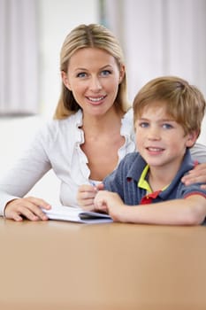 Portrait, teacher and child learning in classroom, smile and education in class. Happiness, student and woman educator teaching, helping or tutoring kid for studying or knowledge in elementary school.