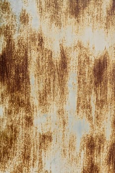 The background of an old iron sheet painted with rust spots. dirty blue background. grunge rusted metal texture, oxidized metal background. Old metal iron panel. vertical photo