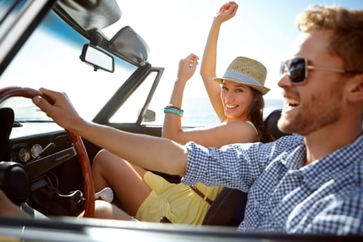 Car road trip, travel and happy couple laughing on holiday adventure, transportation journey or fun summer vacation. Love bond, convertible vehicle and male driver, man and woman driving in Canada.