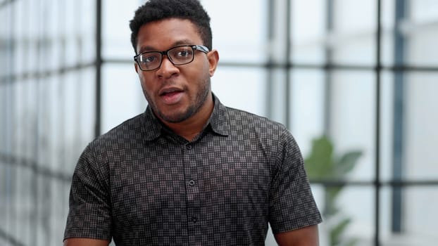 People and lifestyle. Indoor shot of a young confident black businessman looking serious