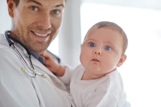 Portrait, pediatrician and holding baby in clinic assessment, medical support and growth. Newborn kids, happy man and pediatrics doctor in hospital for healthcare, consulting and wellness of children.