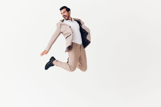 man office flying adult occupation happy running flying beige studio male up winner businessman person jacket job portrait business victory suit smiling
