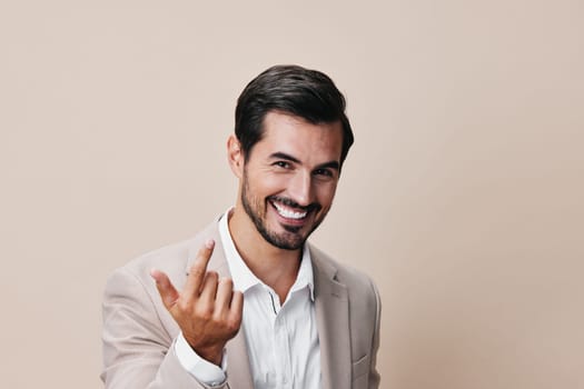 white man young background isolated person tie model crossed posing portrait handsome suit confident copyspace grey smiling business beige happy businessman