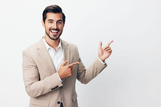 standing man victory tie hand businessman business shirt arm up beige idea winner happy suit background professional fashion person smiling isolated