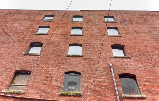 Brick wall of histrical office building in downtown of Vancouver, Canada