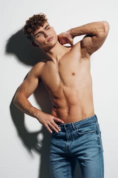 man beauty torso white background sport gray bicep bodybuilder care muscle athlete sexy jeans healthy chest smile male