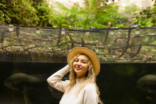 Portrait of a relaxed happy woman in a hat looking at the camera