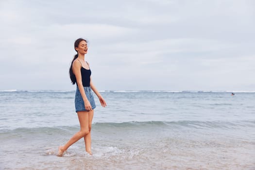 woman water sunset beach long young smiling summer running lifestyle sand sexy sunrise carefree smile fun nature happiness person travel hair sea