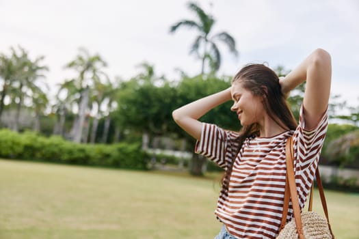 t-shirt woman quiet girl lifestyle freedom smile active grass summer happiness outdoor exercise walk beautiful happy joy nature smiling female park