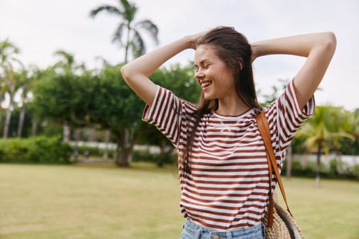 woman hipster smiling joy sunny t-shirt beautiful nature face lifestyle relax sun park exercise quiet health enjoy freedom fun care walk summer