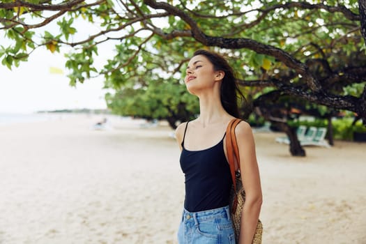 woman summer beach copy-space sea smile female coast nature walking sand sunlight girl vacation happiness freedom young ocean sky caucasian travel