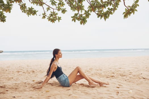 woman alone sand travel beach freedom sexy nature sea sitting vacation smile girl ocean female adult hair relax natural summer fashion