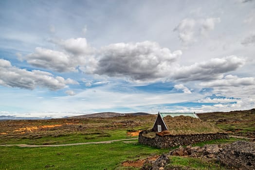 Icelandic traditional turf house at Hveravellir in a cloudy day, Iceland