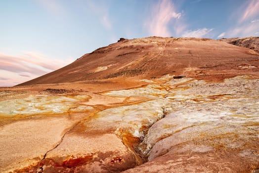 Hverir geothermal area in Iceland is known for bubbling mud pools and steaming fumaroles