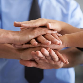 Team building, closeup and hands of business people in support, trust and winner of success, partnership or target goals. Hand huddle, group and cooperation of mission, faq or celebration of teamwork.