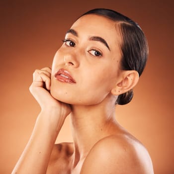 Skincare, beauty and portrait of a woman in studio for cosmetics, makeup and wellness glow or shine promotion. Young face, skin care and girl model in a headshot for aesthetic or dermatology results.