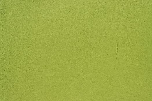 The surface of an old time-damaged wall in green. Background for a design with copy space.