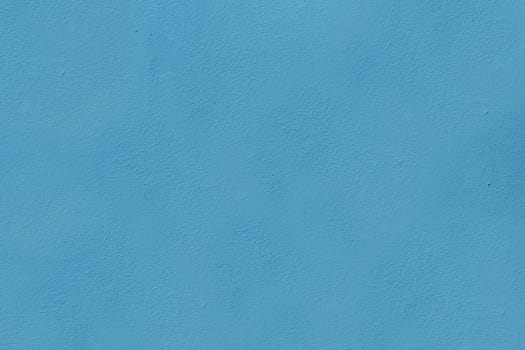 The surface of an old worn wall of blue. Background for a design with copy space.