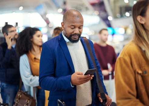 Travel, search and phone with black man in airport for flight, vacation and immigration. Queue, communication and technology with businessman in line with luggage for trip, holiday and first class.
