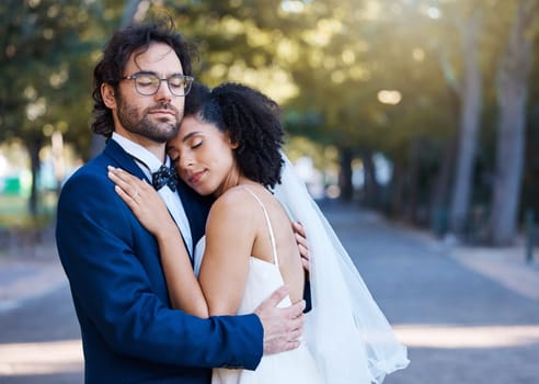 Wedding, bride and groom hug with love, care and celebration in outdoor garden. Bridal couple, marriage and romance with calm support, trust and peace from partner, commitment union and relax at park.