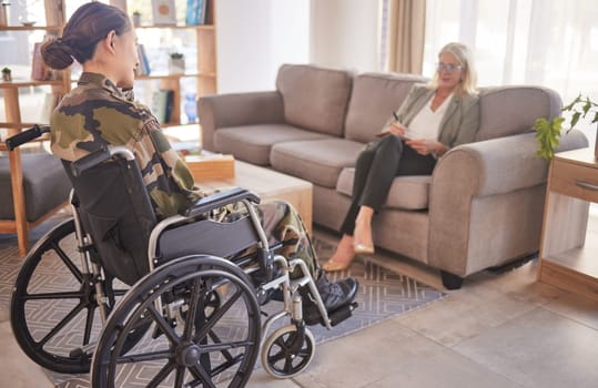 Soldier woman, wheelchair and therapist in talk, rehabilitation or support for war trauma. Psychologist, therapy or military officer for mental health, disability or communication for pain in Ukraine.