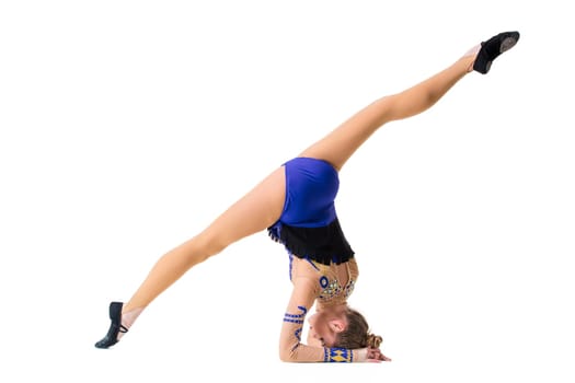 Young gymnast on a white background. Sporting exercises. Aerobics. Flexibility. Plastic study. Twine