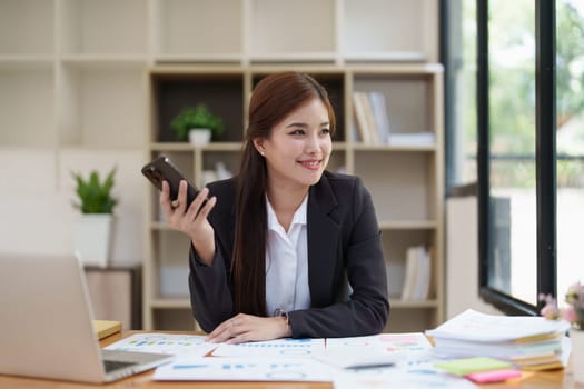 Beautiful business woman talking on the mobile phone. Management, planning and networking phone call concept.