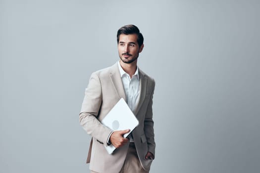 man suit business cheerful stylish male internet job freelancer online cyberspace wireless person smiling notebook computer entrepreneur laptop copyspace isolated professional