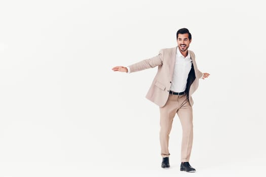 business man shirt running businessman confident jumping work smiling suit happy model winner victory attractive flying success smile portrait arm beige