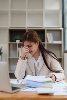 Deadline with young business woman feeling stressed concept. Business woman working at office, business finance concept.