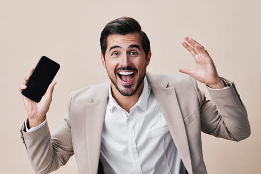 man beige selfies phone internet space phone call studio smartphone gray success business happy portrait hold cellphone copy background smile suit mobile communication