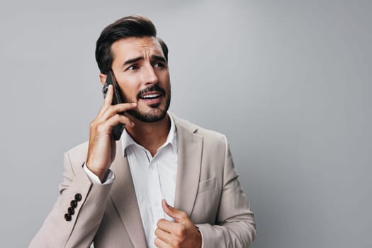 connection man suit smartphone male portrait phone white business hold holding call trading smile background mobile angry application online message guy