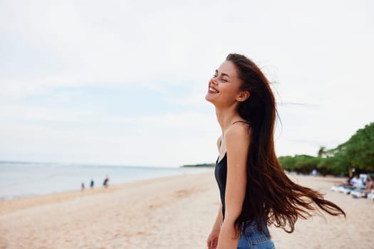 sun woman relax smile long young vacation running female hair nature adult summer happiness beach sunset smiling coast shore ocean sand sea