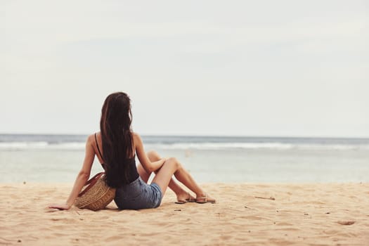 smile woman summer travel beach relax bali sand sitting beauty tan alone white person freedom outdoor nature beautiful sea fashion vacation