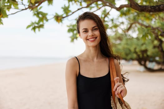 woman copy young summer sand sea sunlight smiling dress outdoor sun smile beach coast space vacation relax ocean travel shore nature free