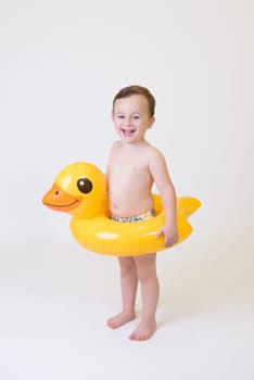 adorable boy with a float on a white background.
