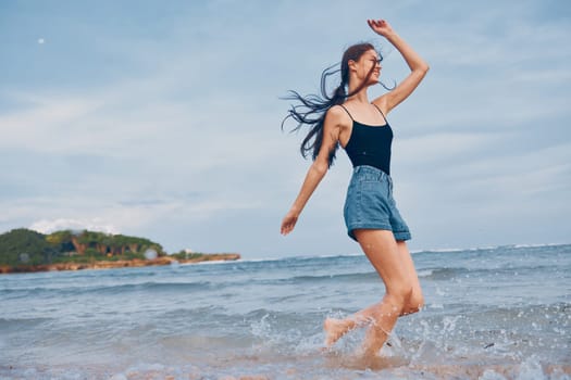 woman travel smile sea freedom lifestyle happiness water person body relax girl shore running young happy summer beach sunset walking positive