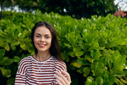 long woman striped t-shirt beautiful hair bali sunset carefree nature sunny freedom outdoor lifestyle smiling female young smile summer park walk hipster